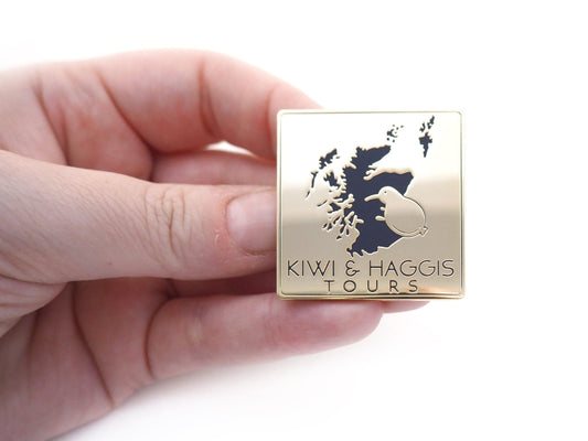 Kiwi & Haggis Tours hard enamel pin.